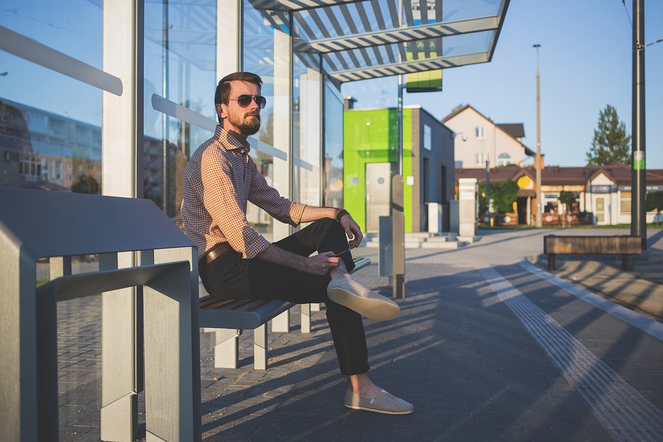 man waiting on a bus station