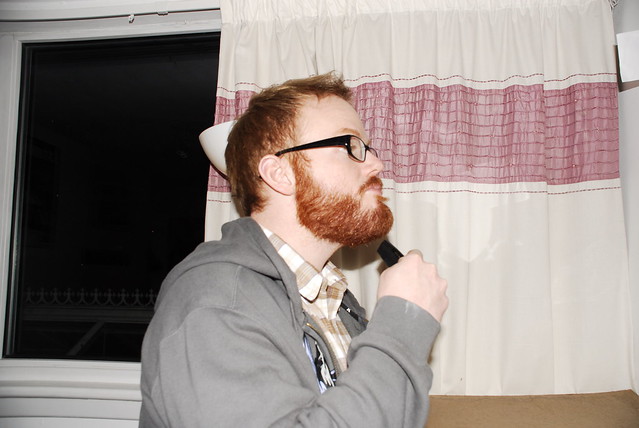 man combing his beard