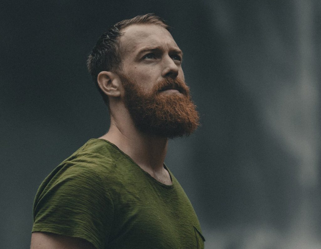 bearded man lookin up