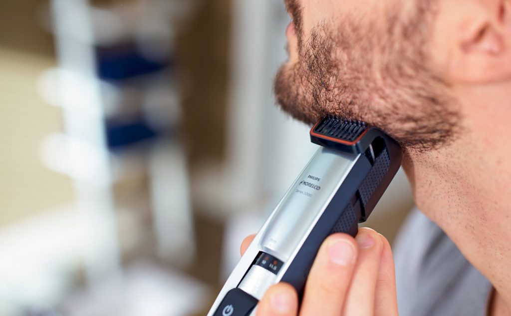 Man using one of the best beard trimmer models today, the Philips Norelco Series 5100