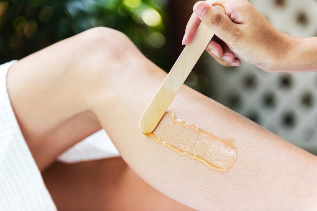 applying a cream on a leg