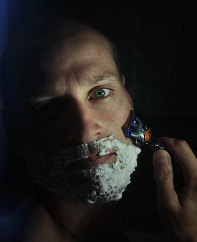 man shaving with shaving foam