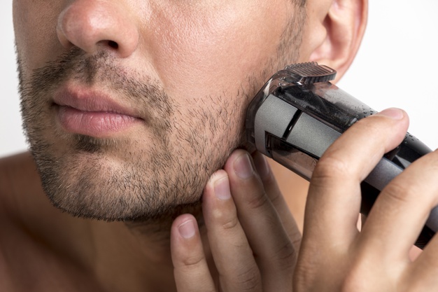 man using black trimmer